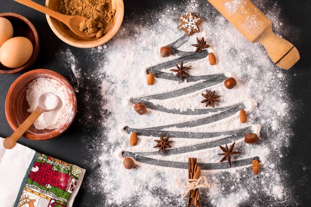 Top view of christmas tree shape with flour and star anise