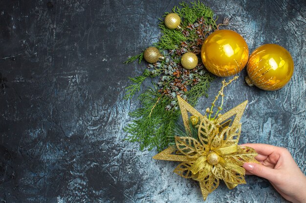 Top view christmas tree toys on light-dark background