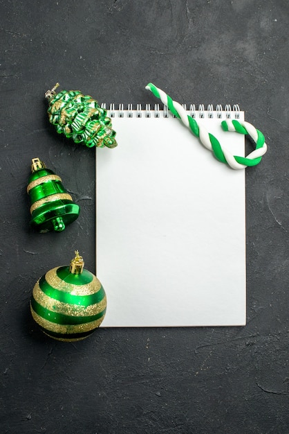 Top view christmas tree toys with notepad