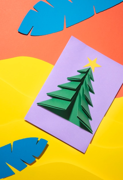 Top view christmas tree and tropical leaves