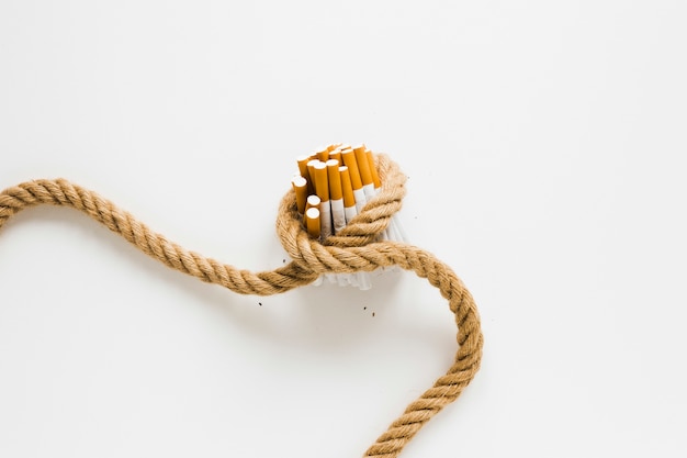 Top view cigarettes tied by a rope