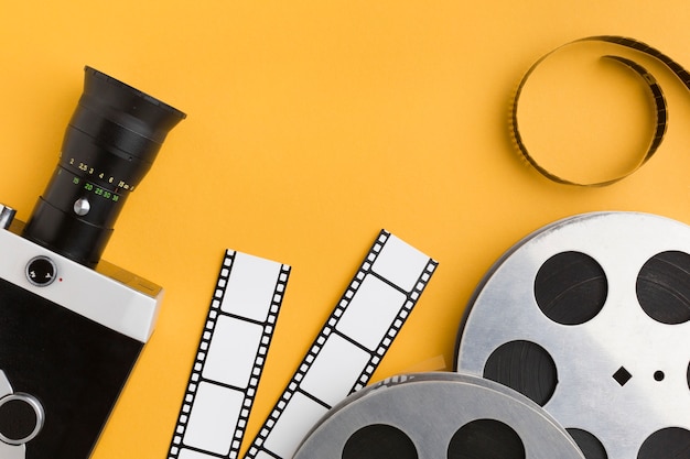 Top view cinema elements on yellow background