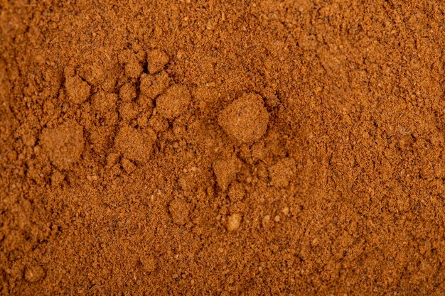 Top view of cinnamon powder textured background