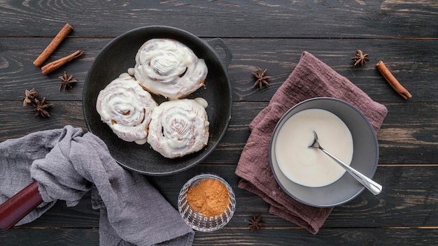 Top view cinnamon rolls with cream
