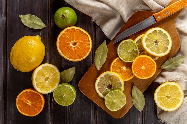 Top view of citrus slices with knife