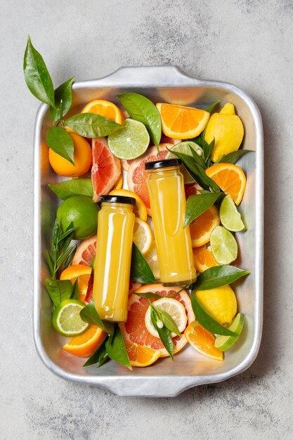 Top view citrus with juice bottles