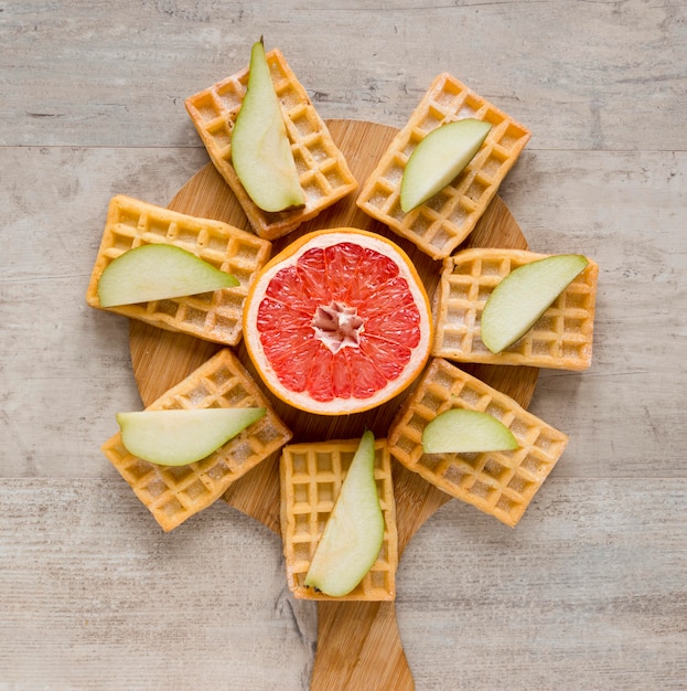 Top view of citrus with waffles and pears