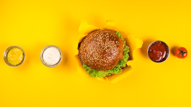 Top view classic burger with various dips