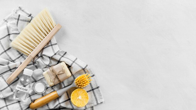 Top view of cleaning brushes with soap and copy space