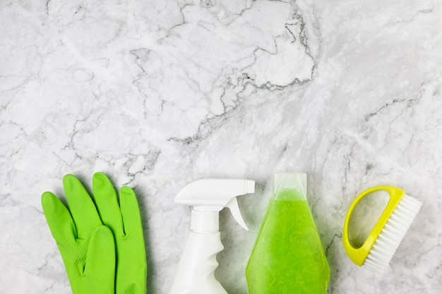 Top view cleaning items on marble table