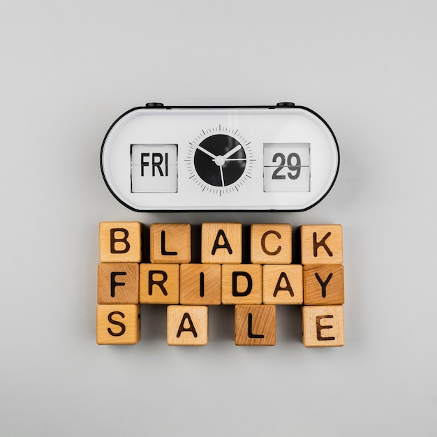 Free photo top view of clock and black friday sale cubes