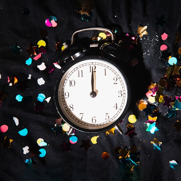 Top view clock with colorful confetti