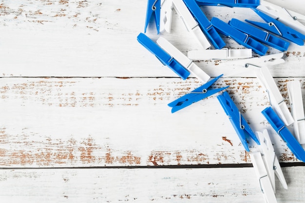 top view clothespin on wooden background