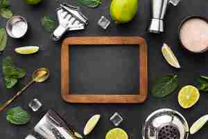 Free photo top view of cocktail essentials with blackboard and lime