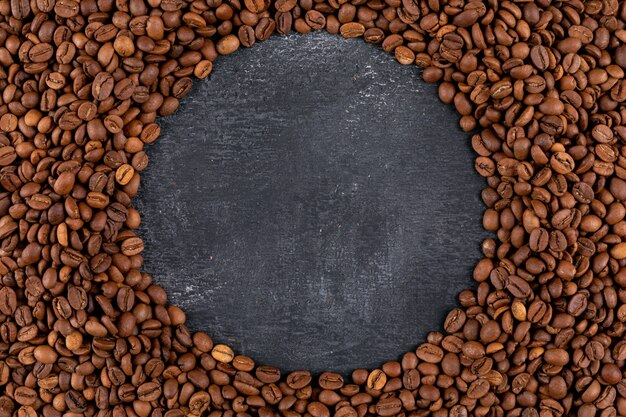 Top view coffee beans  on dark surface