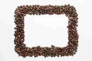 Free photo top view of coffee beans frame with copy space