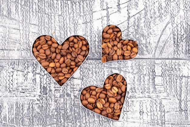 Top view coffee beans heart shape on retro surface