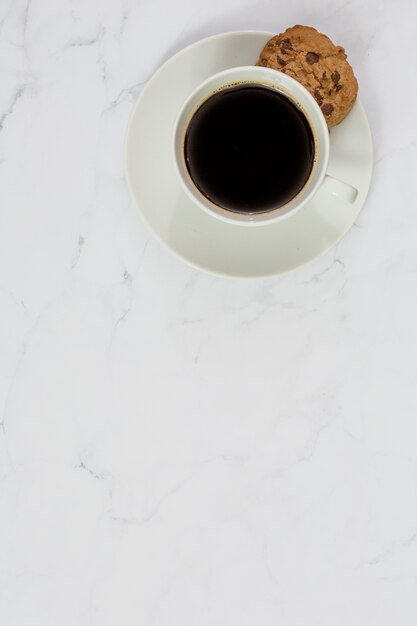 Top view of coffee and cookie