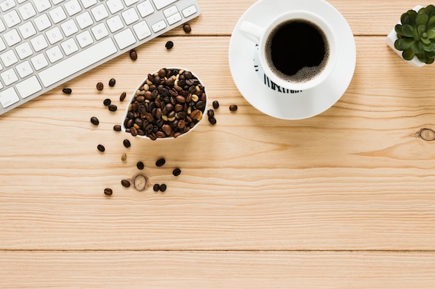 Top view of coffee cup and beans