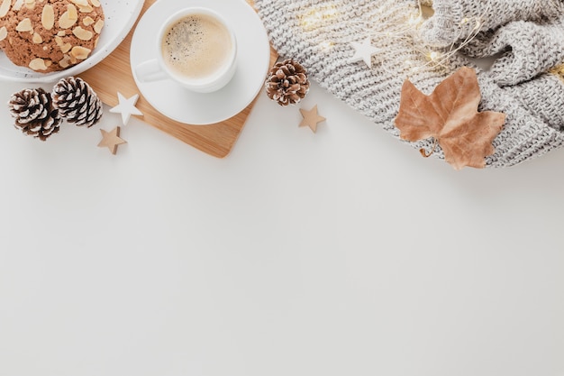 Top view coffee cup and cookies with copy-space