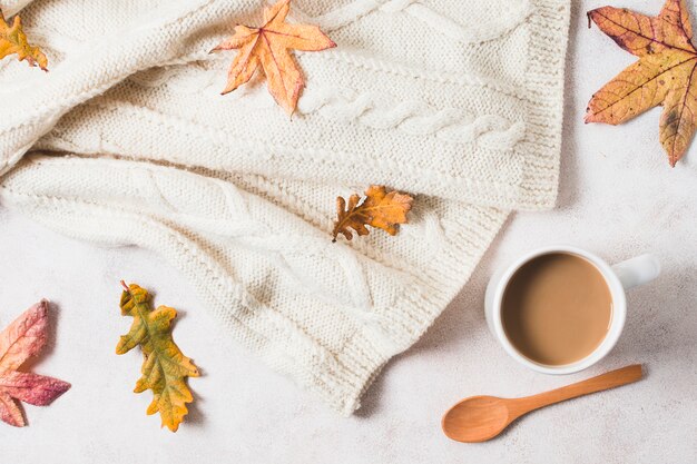 Top view coffee cup and sweater