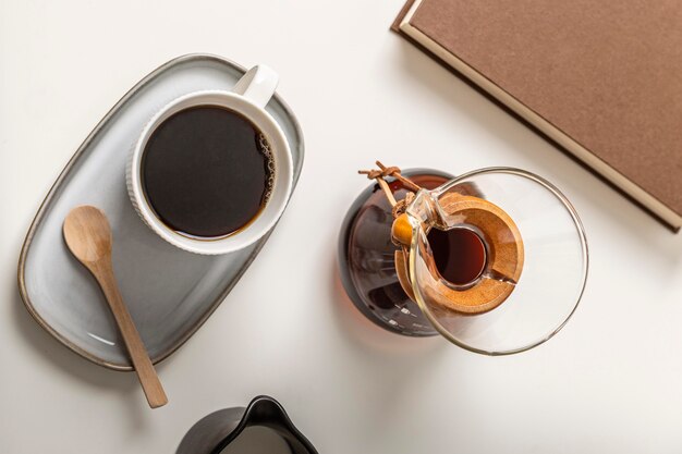 Top view of coffee cup with chemex and book