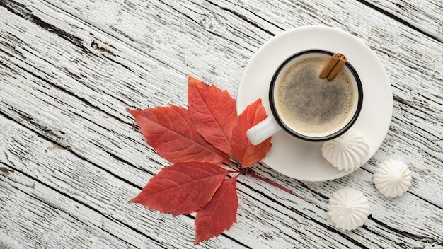 Free photo top view of coffee cup with leaf