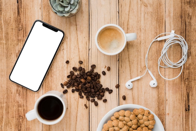 Top view coffee cup with mobile phone