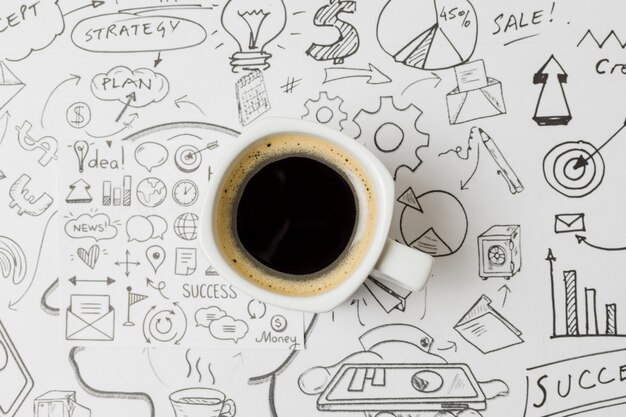 Top view coffee on papel full of doodles