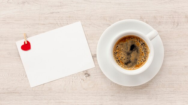 Top view of coffee and paper for valentines day