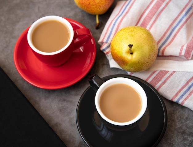 Top view of coffee and pears breakfast