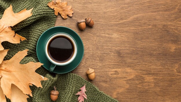 Top view of coffee with copy space and autumn leaves