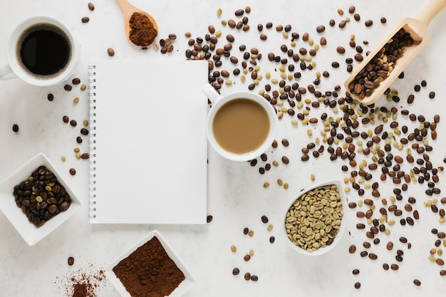 Top view of coffee with notebook mock-up
