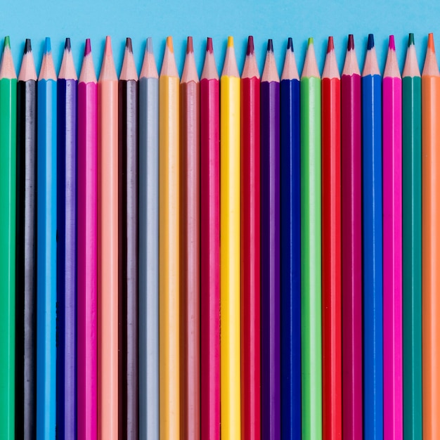 Free photo top view collection of colourful pencils on the desk