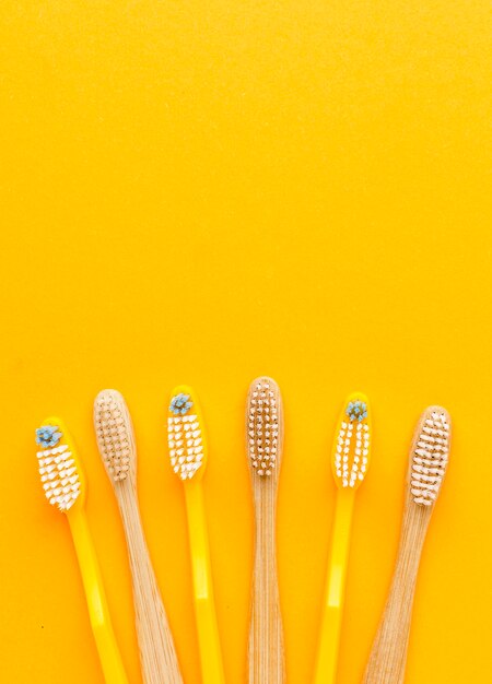 Top view collection of organic toothbrushes with copy space