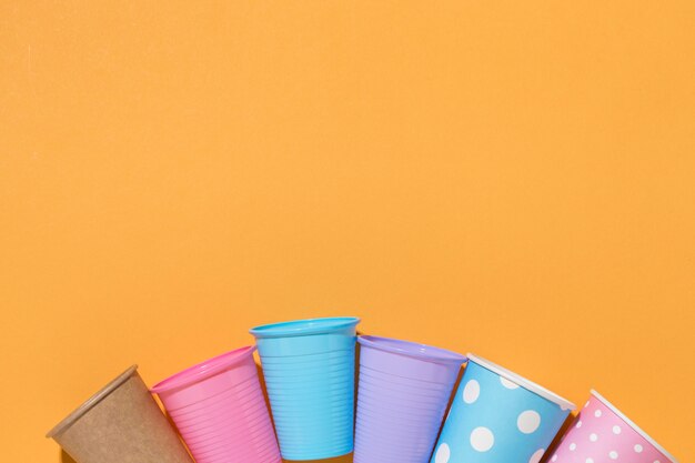 Top view collection of plastic cups on the table