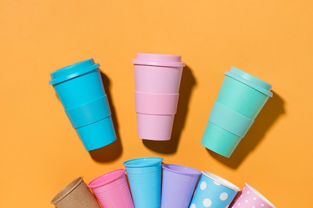 Top view collection of plastic cups on the table