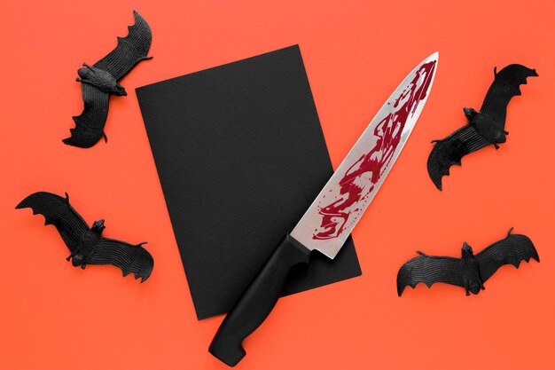 Top view collection of spooky halloween bats with knife