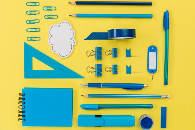 Top view collection of stationery objects on the table