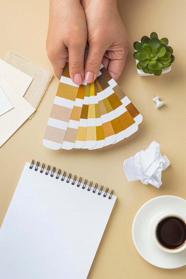 Free Photo top view of color palette for house renovation with notebook