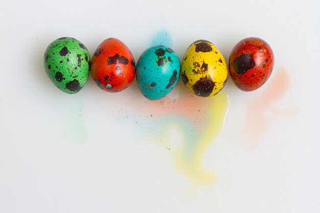 Top view of colored eggs for easter with copy space