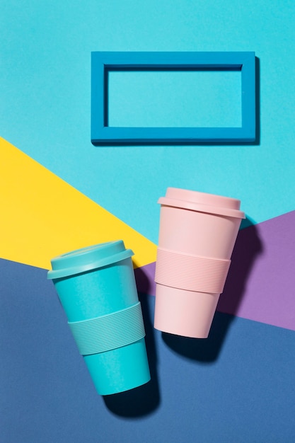 Top view colored reusable cups on the table