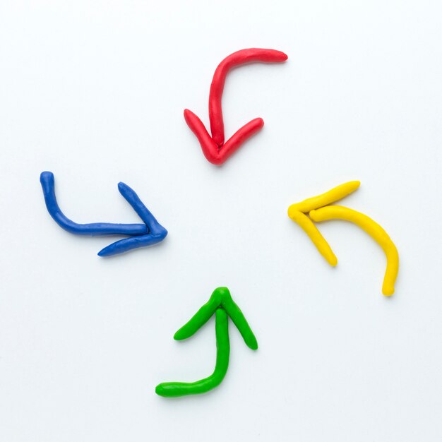 Top view of colorful arrows pointing in center
