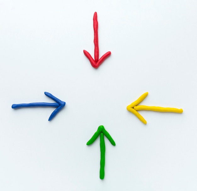 Top view of colorful arrows pointing in center