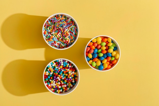 Top view of colorful assortment of candy in cup