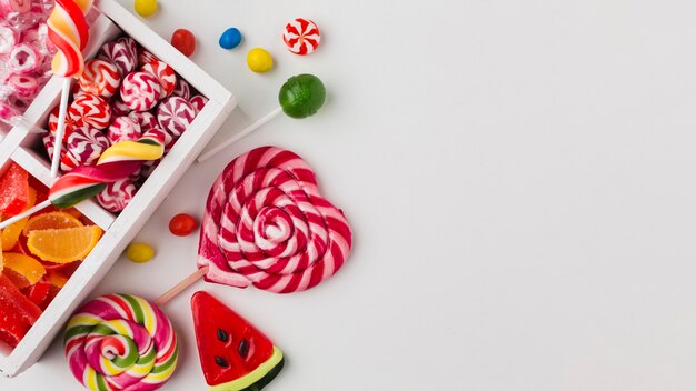 Top view colorful candies with copy space