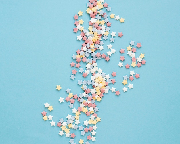 Top view colorful candy on blue background