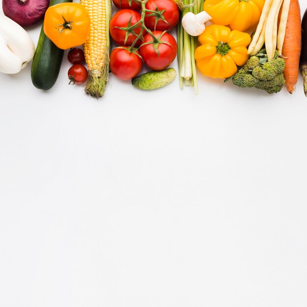 Top view colorful composition of vegetables with copy space
