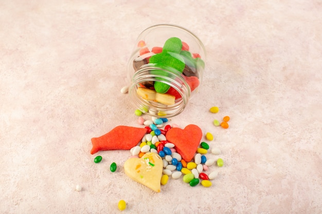 Top view of colorful delicious cookies different formed inside can with candies