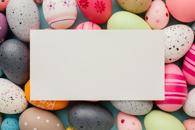 Top view of colorful easter eggs with paper